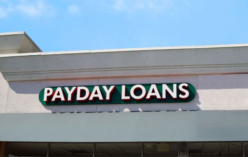 outside building with Payday Loans listed